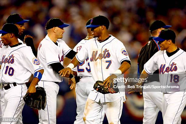 Jose Reyes of the New York Mets and his teamates celebrate after defeating the Los Angeles Dodgers after Game One of the National League Division...