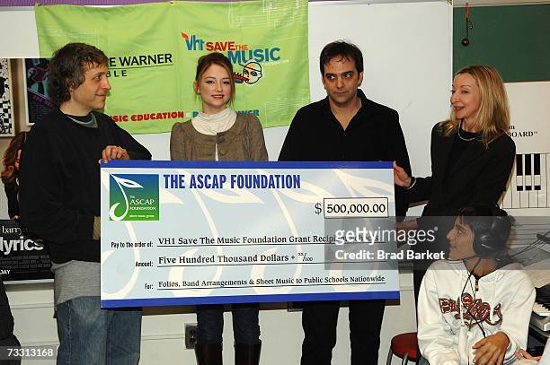 Director Marc Lawrence, actress Haley Bennett, composer Adam Schlesinger, and director of VH1Save the Music Foundation Laurie Schopp donate a check...