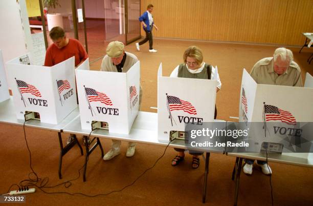 Residents of El Paso, Texas cast their ballot for president of the United States in early voting, October 23, 2000. The state of Texas has early...