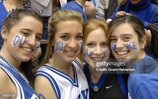 Fans pose at the start of a game between the Duke Blue Devils and the North Carolina Tar Heels on February 7, 2007 at Cameron Indoor Stadium in...