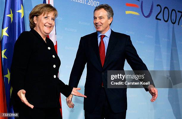 German Chancellor Angela Merkel and British Prime Minister Tony Blair leave after a news conference February 13, 2007 at the Chancellery in Berlin,...