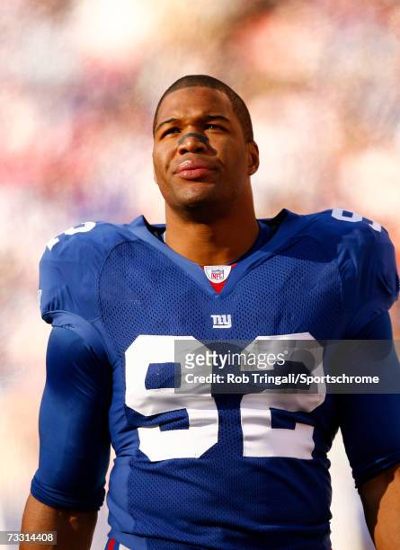 Defensive End Michael Strahan of the New York Giants looks on against the New Orleans Saints on December 24, 2006 at Giants Stadium in East...
