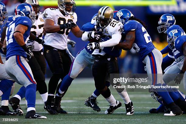 Running Back Reggie Bush of the New Orleans Saints runs with the ball against the New York Giants on December 24, 2006 at Giants Stadium in East...