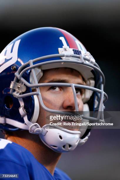 Quarterback Eli Manning of the New York Giants looks on against the New Orleans Saints on December 24, 2006 at Giants Stadium in East Rutherford, New...