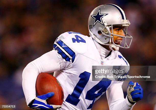 Wide receiver Miles Austin of the Dallas Cowboys runs with the ball against the New York Giants at Giants Stadium on December 3, 2006 in East...