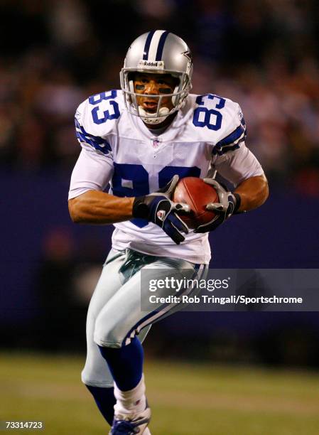 Wide receiver Terry Glenn of the Dallas Cowboys runs with the ball against the New York Giants at Giants Stadium on December 3, 2006 in East...