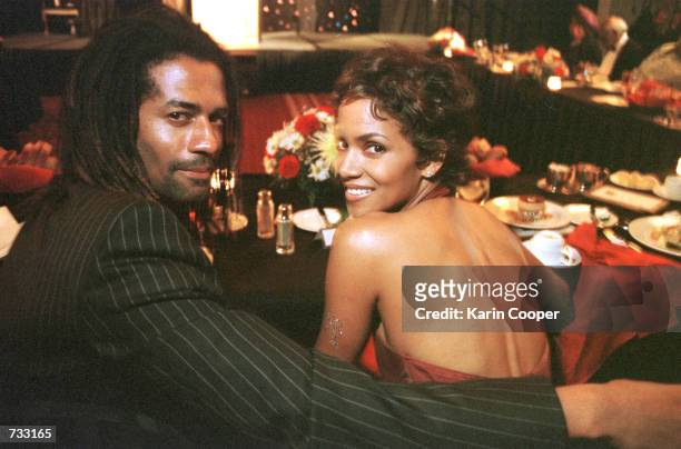 Actress/model Halle Berry and boyfriend Eric Benet attend a dinner in her honor in Washington, D.C. Where she received an achievement award from...