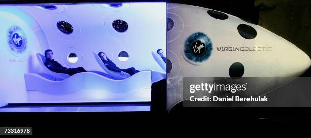 Virgin employees sit in the cabin of a prototype Virgin Galactic SpaceShipTwo spacecraft at the Science Museum on February 14, 2007 in London,...