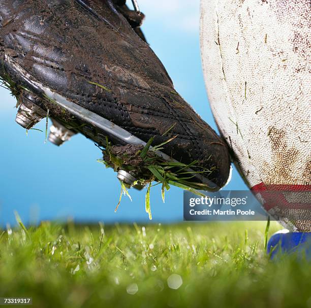 rugby player kicking ball off tee, close up of foot - studded stock pictures, royalty-free photos & images