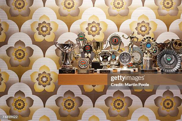 trophies on a shelf - trophy shelf stock pictures, royalty-free photos & images