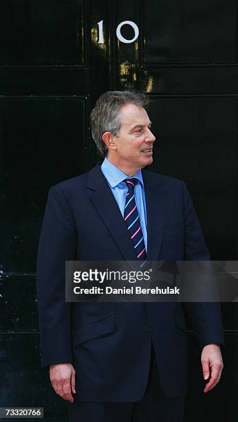 British Prime Minister Tony Blair waits on the doorstep before meeting with Afghanistan President Hamid Karzai outside his Downing St residence on...