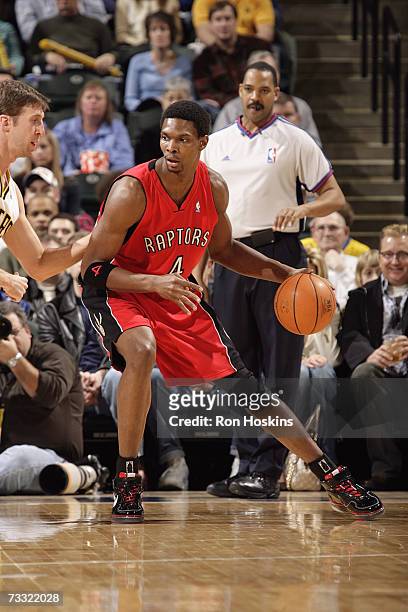 Chris Bosh of the Toronto Raptors posts up Troy Murphy of the Indiana Pacers during the game at Conseco Fieldhouse on January 27, 2007 in...