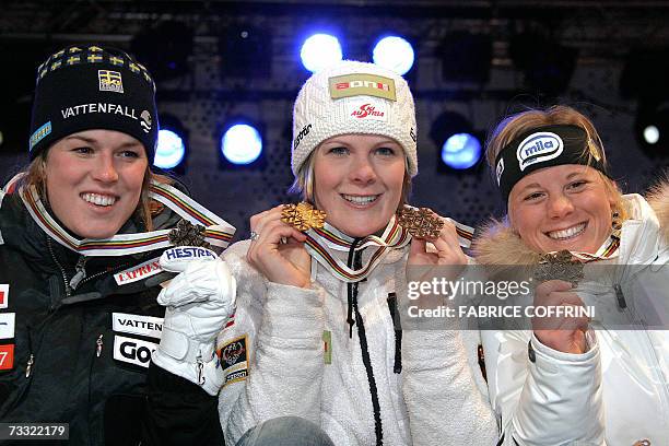 Nicole Hosp of Austria, Sweden's Maria Pietilae-Homer and Italian Denise Karbon pose during the medal ceremony a day after the women's giant slalom,...