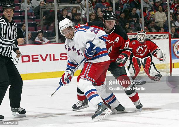 Jason Krog of the New York Rangers skates into position against John Madden of the New Jersey Devils on February 6, 2007 at the Continental Airlines...
