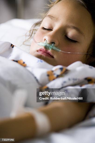 young girl in hospital bed with respirator - beatmungsgerät stock-fotos und bilder
