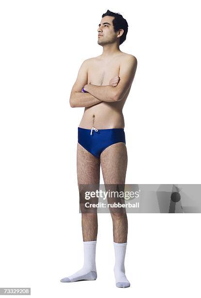 man in swimsuit and socks with arms crossed - young men in speedos 個照片及圖片檔