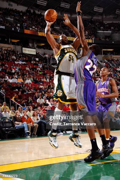 Chris Wilcox of the Seattle SuperSonics shoots against the defense of James Jones of the Phoenix Suns on February 14, 2007 at the Key Arena in...