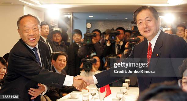 Chinese foreign minister Li Zhaoxing meets with Akihiro Ohta , the New Komeito Party chief representative at a Tokyo hotel on February 15, 2007 in...