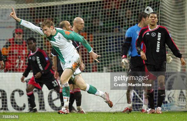 Per Mertesacker of Bremen celebrates after scoring the 1st goal during the UEFA Cup Round of 32 match between Werder Bremen and Ajax Amsterdam at the...