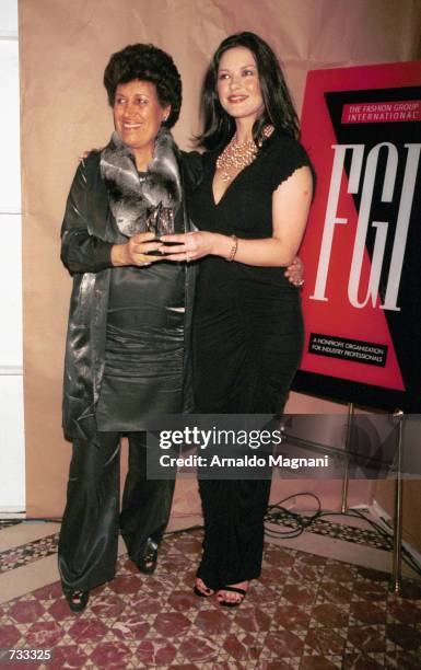 Carla Fendi, president of Fendi, and actress Catherine Zeta Jones, right, receive an award October 24, 2000 during The Fashion Group International's...