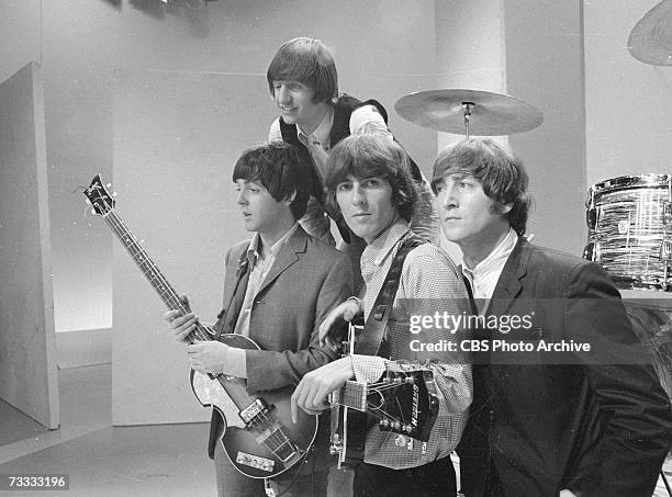 Members of the British popular rock and roll band The Beatles, Paul McCartney, Ringo Starr, George Harrison , and John Lennon , pose for a group...