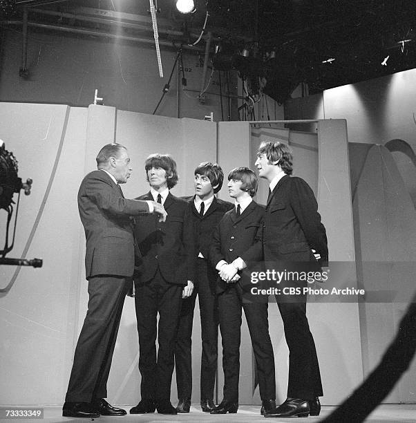 American variety show host Ed Sullivan talks with members of the British popular rock and roll band The Beatles, George Harrison , Paul McCartney,...