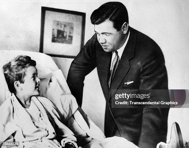 Babe Ruth visits young Johnny Sylvester, a fan suffering from a spinal infection, in a New York Hospital during the season of 1926.