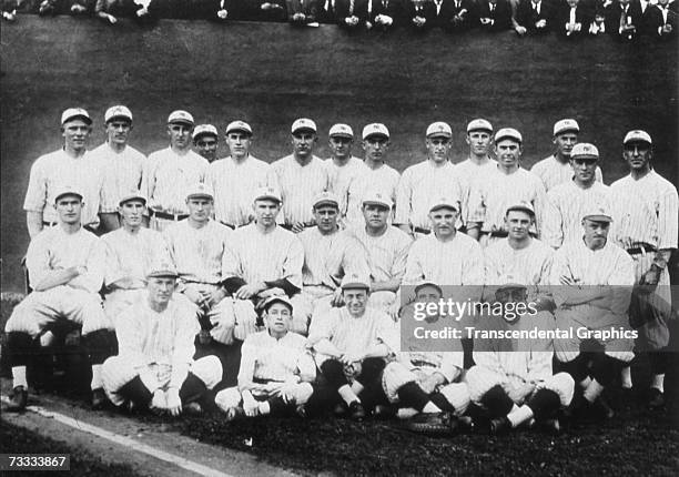 The New York Yankees pose for their team portrait in 1921. In the middle row Babe Ruth sits fourth from right and Waite Hoyt second from right, while...