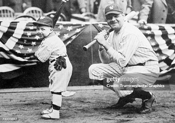 New York Yankees batboy, Ray Kelly, left, poses with Babe Ruth in Yankee Stadium before a game against the Boston Red Sox during Opening Day on April...