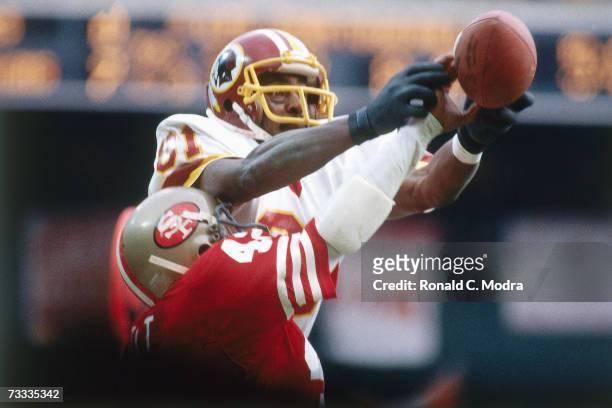 Art Monk of the Washington Redskins goes up for a pass and Ronnie Lott of the San Francisco 49ers is called for interference during the NFC...