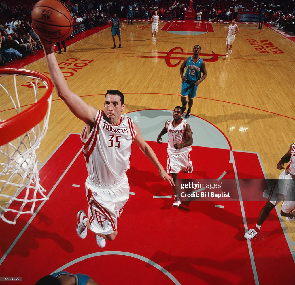 Hornets Rockets 2002 Scott Padgett of the Houston Rockets takes the ball to the basket ...