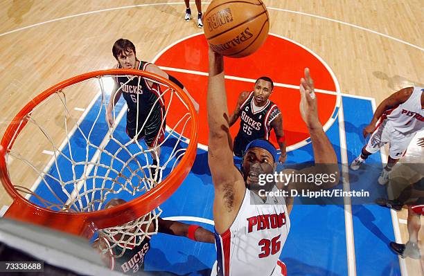 Richard Hamilton of the Detroit Pistons goes to the basket against Andrew Bogut and Maurice Williams of the Milwaukee Bucks during the game at The...