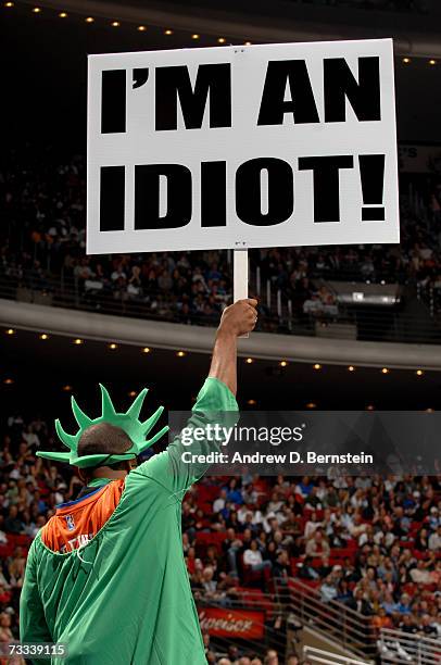 Fan, wearing a Statue of Liberty costume, mocks the New York Knicks during the game against the Orlando Magic on February 3 at Amway Arena in...