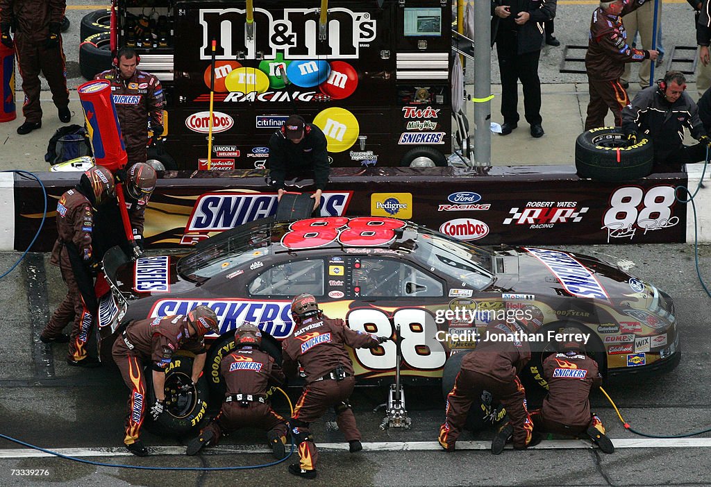 Snickers Dark Car Ricky Rudd Ricky Rudd, driver of the Snickers Ford, pits during the Gatorade ...