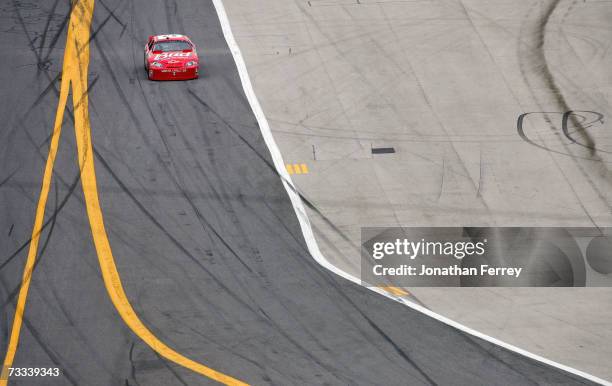 Dale Earnhardt Jr., driver of the Budweiser Chevrolet, drives towards pit road with a flat tire, during the Gatorade Duel at Daytona International...