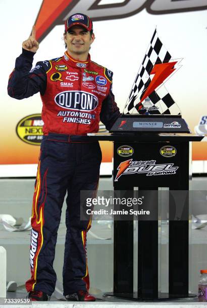 Jeff Gordon, driver of the DuPont Chevrolet, celebrates in victory lane, after winning the Gatorade Duel at Daytona International Speedway on...