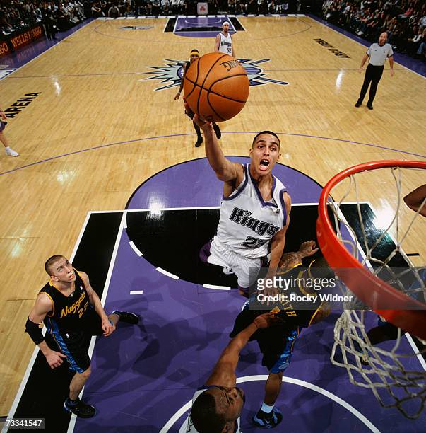 Kevin Martin of the Sacramento Kings shoots a layup against J.R. Smith of the Denver Nuggets during a game at Arco Arena on February 3, 2007 in...