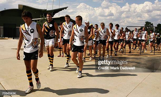 Richmond players walk to a food transport vehicle used to bring the players body temperatures down during the Richmond Tigers intra-club AFL match at...