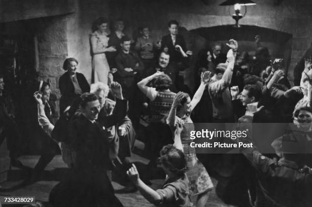 Actors performing a cèilidh sequence on the set of 'I Know Where I'm Going!', directed by Michael Powell and Emeric Pressburger, 1945. Original...