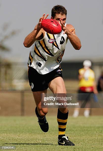 Trent Knobel of Team King gathers the ball during the Richmond Tigers intra-club AFL match at Casey Fields on February 16, 2007 in Melbourne,...