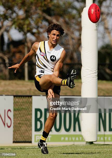 Darren Gaspar of Team King kicks out from fullback during the Richmond Tigers intra-club AFL match at Casey Fields on February 16, 2007 in Melbourne,...