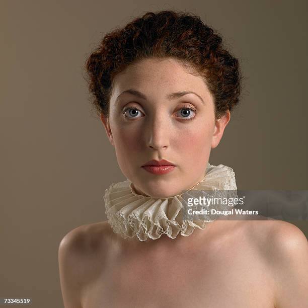 young woman wearing frilly collar, portrait - frilly stockfoto's en -beelden