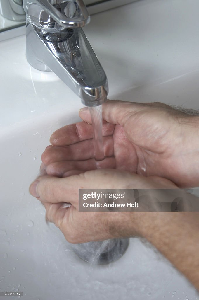 Man washing hands, close-up