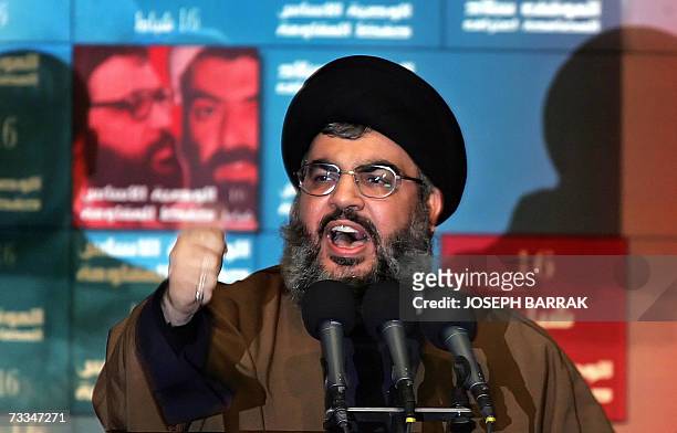 Hezbollah chief Hassan Nasarallah gestures as he delivers a speech during a ceremony to mark the annual commemoration of the killing of two senior...