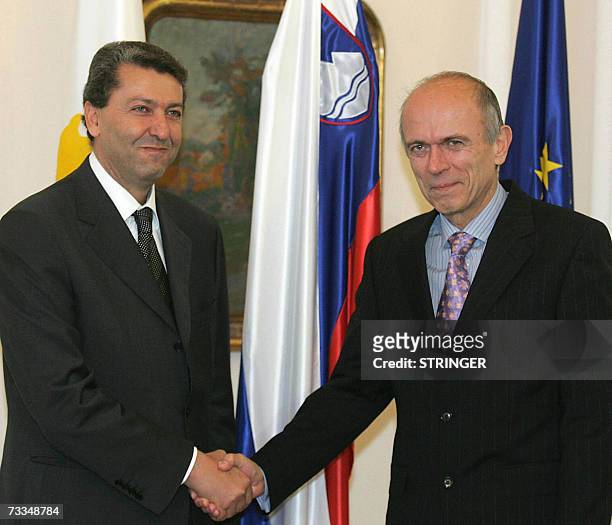 Foreign Minister of Cyprus Yiorgos Lillikas shakes hands with Slovenian President Janez Drnovsek before their meeting in Ljubljana 16 February 2007....