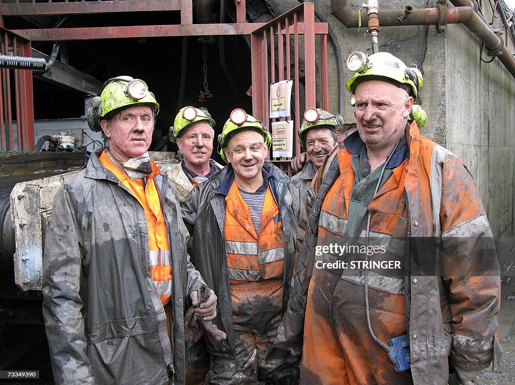 Miners at a coal mine in the village of...