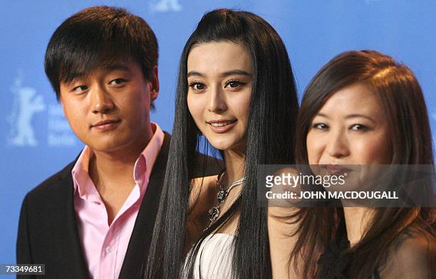 Chinese actors Tong Da-Wei and Fan Bing-Bing and Chinese director Li Yu pose during a photocall for the film "Ping Guo - Lost in Beijing" competing...