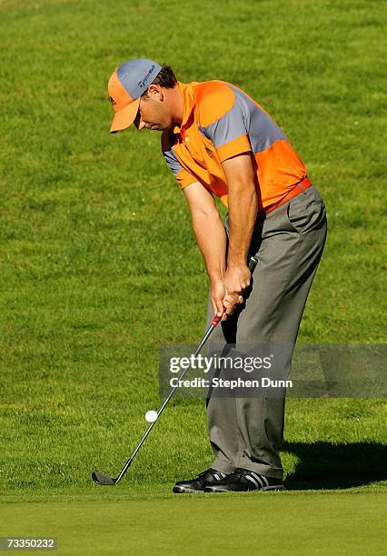 Sergio Garcia of Spain chips onto the fourth green during the second round of the Nissan Open on February 16, 2007 at Riveria Country Club in Pacific...