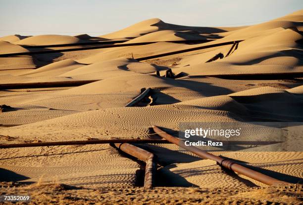 Gas pipeline constructed through sand dunes has been exposed by wind and movement of the desert sands on September, 1997 in Gumdag, Turkmenistan.