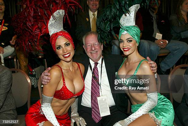 Las Vegas Mayor Oscar Goodman sits court side with two dancers during the McDonald's NBA All-Star Celebrity Game Presented by 2K Sports at NBA Jam...